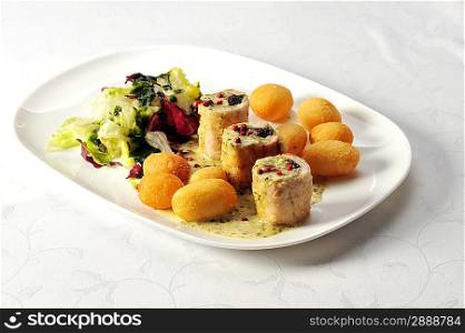 Fried stuffed turkey fillet with cheese and vegetables