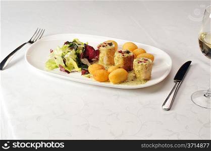 Fried stuffed turkey fillet with cheese and vegetables