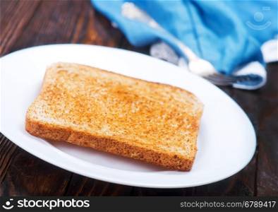 fried tost on plate and on a table