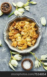 Fried yucca flowers.An unusual dish of edible flowers.. Fried yucca flowers