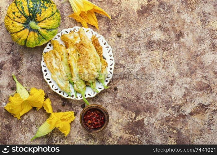 Fried zucchini flowers stuffed with cheese.Flowers zucchini or squash. Stuffed zucchini flowers