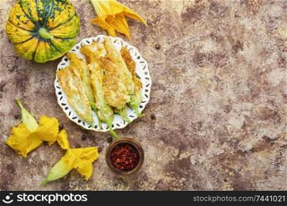 Fried zucchini flowers stuffed with cheese.Flowers zucchini or squash. Stuffed zucchini flowers