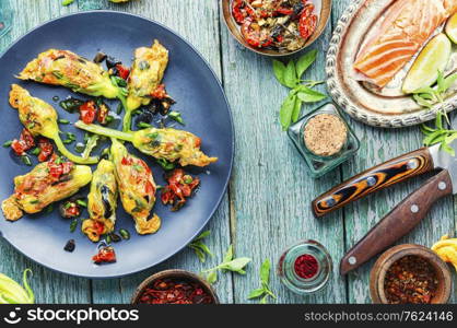 Fried zucchini flowers stuffed with salmon and sun-dried tomatoes.. Fried zucchini flowers stuffed fish