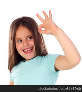 Friendly child saying Ok with her hand isolated on a white background