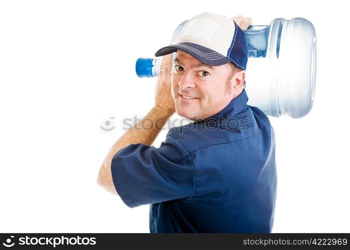 Friendly delivery man carrying a five gallon jug of drinking water over his shoulder. Isolated on white.