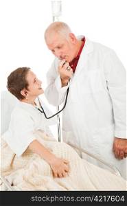 Friendly doctor entertains a young patient by blowing in the stethoscope. Isolated on white.