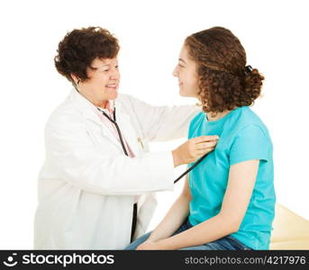 Friendly female doctor examines a teenage girl in her office. Isolated on white.