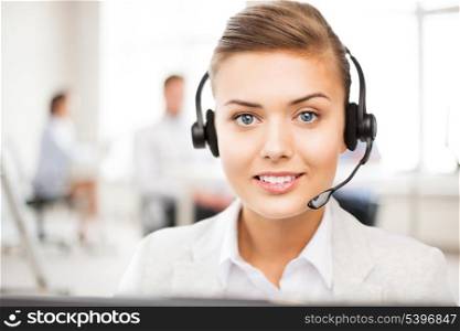 friendly female helpline operator with headphones in call centre