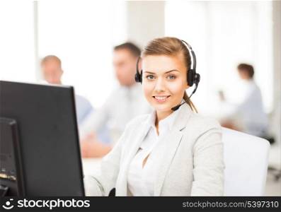 friendly female helpline operator with headphones in call centre