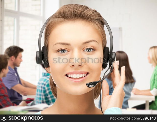 friendly female helpline operator with headphones in office