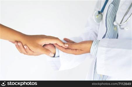 Friendly female medicine doctor hands holding woman patient hand for encouragement and empathy partnership trust and medical ethics support patient cheering and support reassuring