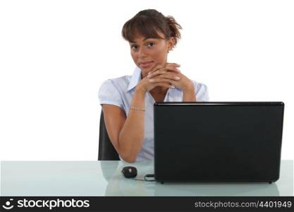Friendly female sat at desk
