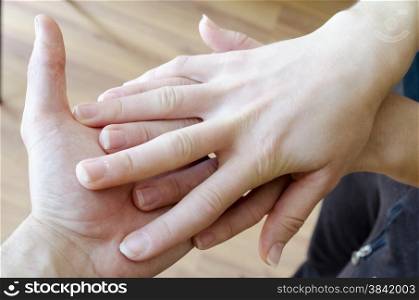 Friendly handshake. Man and woman shaking hands as welcoming gesture.