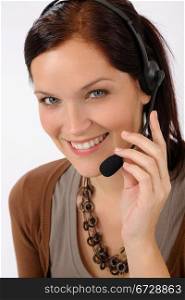 Friendly help desk woman smiling call center operator phone headset