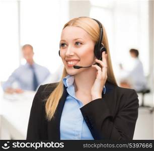 friendly helpline operator with headphones in call centre