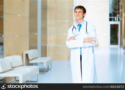 friendly male doctor. Portrait of friendly male doctor in hospital smiling