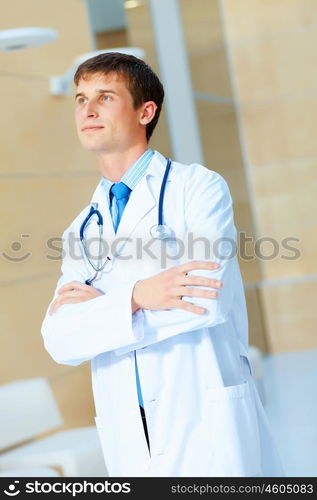 friendly male doctor. Portrait of friendly male doctor in hospital smiling