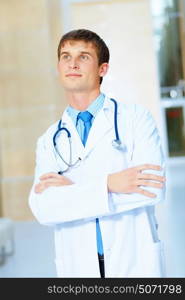 friendly male doctor. Portrait of friendly male doctor in hospital smiling