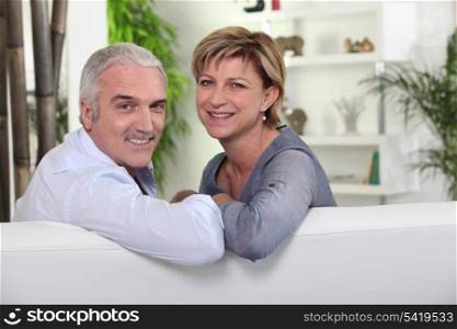 friendly mature couple in a lounge