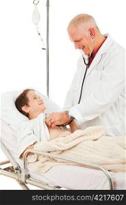 Friendly smiling doctor examines a little boy in the hospital. Isolated on white.