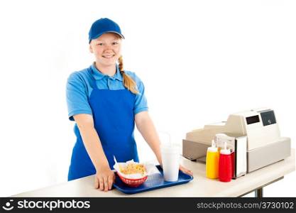 Friendly, smiling teenage cashier serving fast food in a restaurant. Isolated on white.