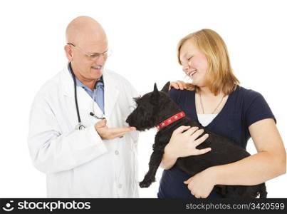 Friendly veterinarian with teen girl and her Scotty dog. Isolated on white.