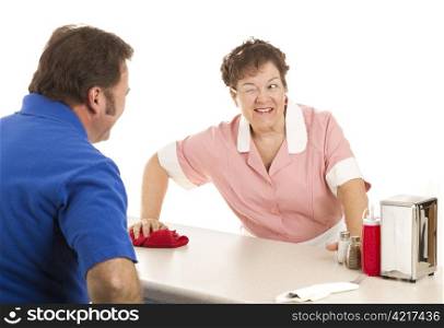 Friendly waitress winks at a customer as she wipes down the lunch counter. White background.