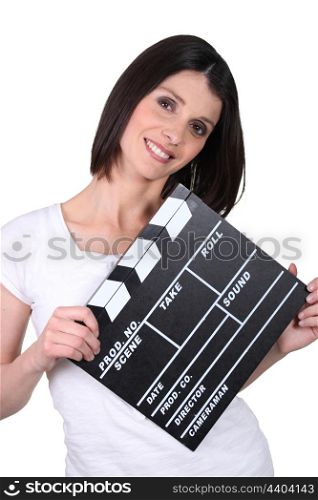 Friendly woman with a clapperboard