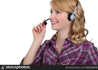 Friendly woman with a telephone headset