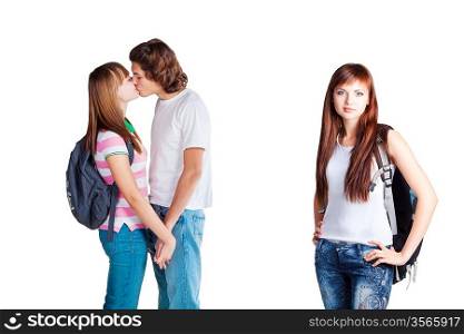 friends are kissing and lonely girl is standing with backpack on white background