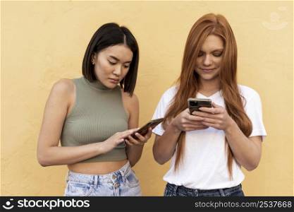 friends checking their phones