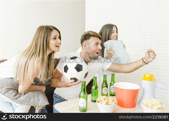 friends cheering watching football home_2
