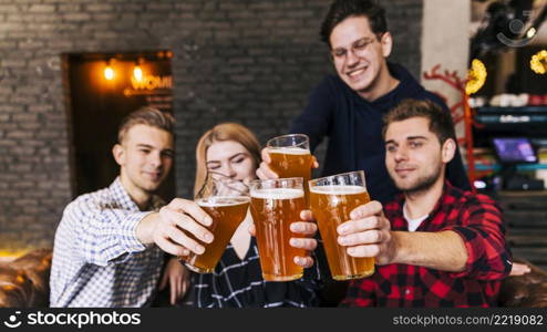 friends clinking glasses with beer pub