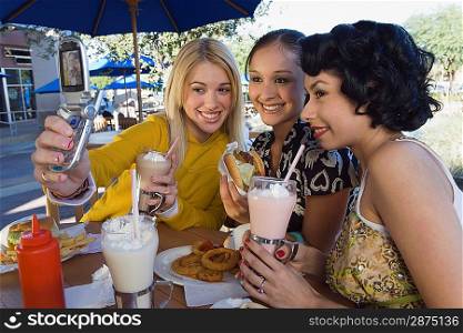 Friends Drinking Milkshakes and Posing for Photo