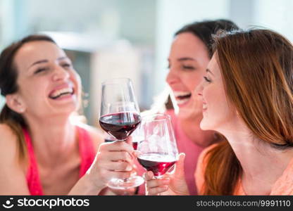 Friends drinking wine in restaurant