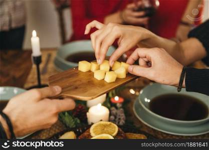 friends eating cheese christmas