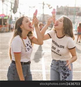 friends eating ice cream amusement park