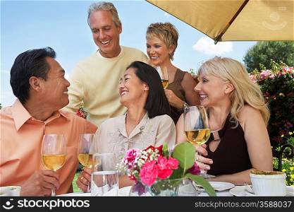 Friends Enjoying a Glass of Wine Outdoors