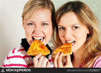 Friends enjoying their slice of pizza
