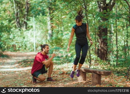 Friends Exercising Outdoors, Park, Nature. Friends Exercising in the Park