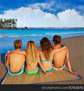 friends group couples sitting in beach sand rear view Alcudia Mallorca photo mount