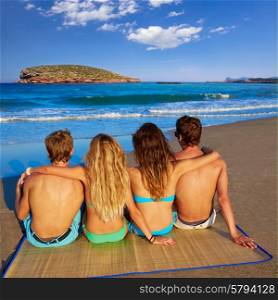 friends group couples sitting in beach sand rear view Ibiza photo mount