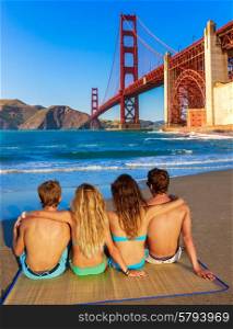 friends group couples sitting in beach sand rear view San Francisco Golden Gate photo mount