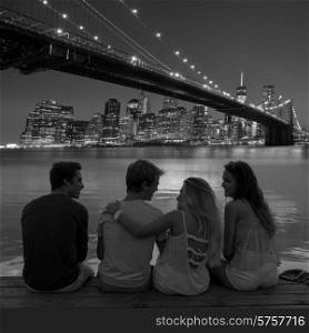 Friends group rear view at sunset happy fun in New York Manhattan photo mount