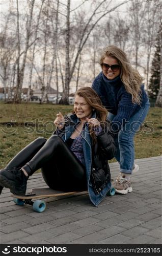 friends having fun outdoors with skateboards