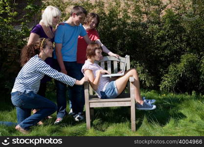 Friends looking at a laptop