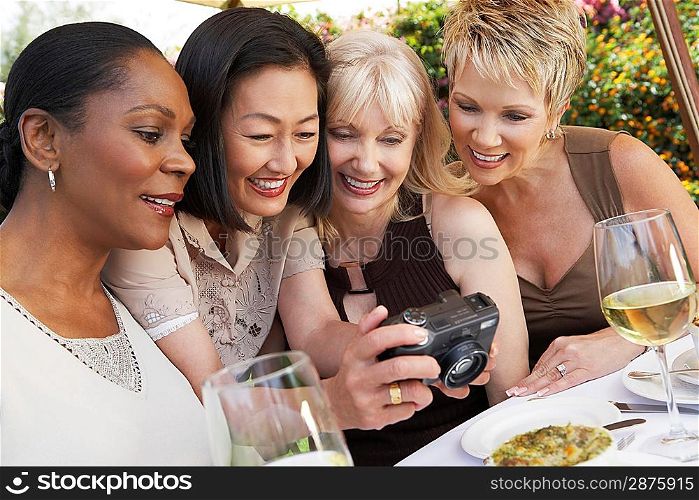 Friends Looking at Photos on a Digital Camera