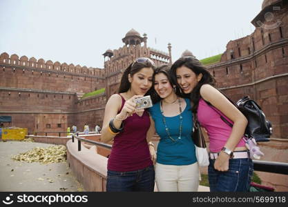 Friends looking at their photograph