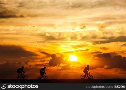 Friends on a bike trip at sunset. Active lifestyle, cycling hobby. freedom and health.. Friends on a bike trip at sunset. Active lifestyle, cycling hobby.