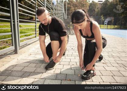 friends outdoor training bind their shoelaces